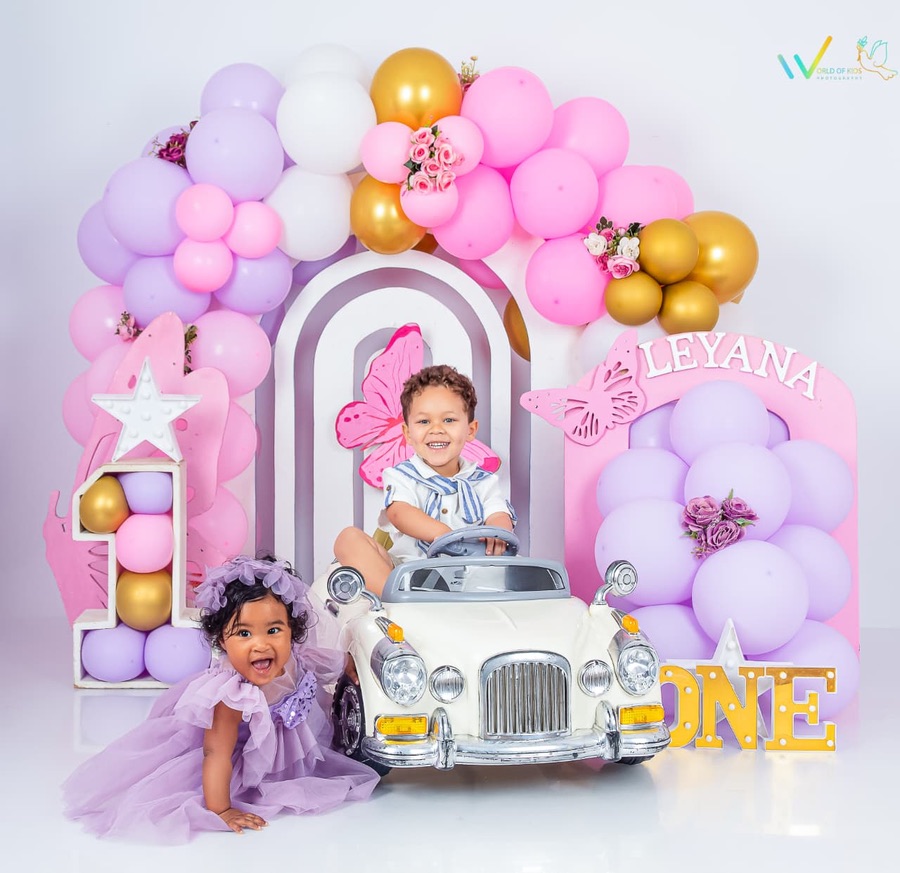 Raaziq and Leyana in a pink, lilac and gold first birthday setup